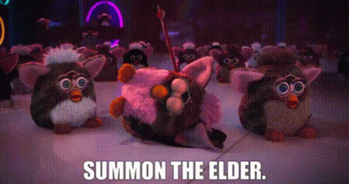 a horde of grey furbies, with one lying with an arrow through its head. one says, 'summon the elder.'